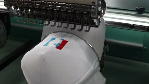 Footage of Embroidery caps in progress by Computerized machine embroidery Video stock 139962154