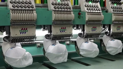 Footage of Embroidery caps in progress by Computerized machine embroidery Video stock 139962245
