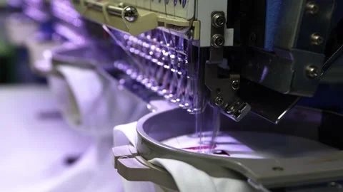 Footage of Embroidery caps in progress by Computerized machine embroidery Stock Footage 139962254