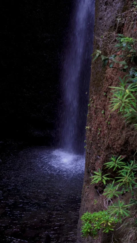 Footage emphasizes the graceful motion of waterfall from Levada Nova falling 库存影片 345228132