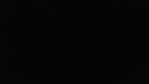 Footage of fast train passing by at night. Locomotive and wagons, going nightly Stock Footage 160560123