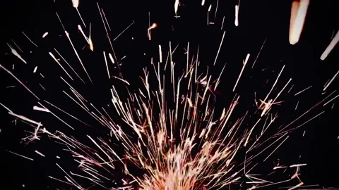 Footage of a fire sparkles in the dark background Stock Footage 274353926