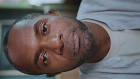 Footage of focused good-looking African American man with brown eyes looking Stock Footage 238749357