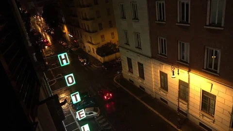 Footage from fourth floor looking down out of hotel window on streets rain 4k Stock Footage 75957681