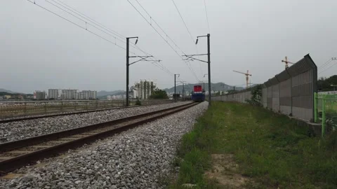 Footage of freight train and passenger train crossing Stock Footage 130609352