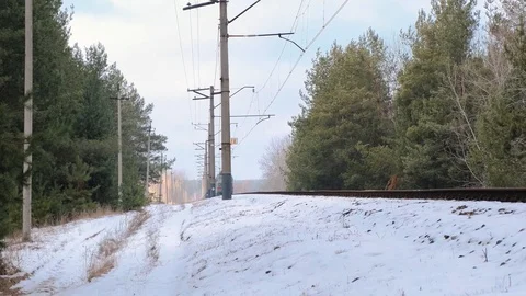 Footage of freight train on rails in winter forest Stock Footage 125478442