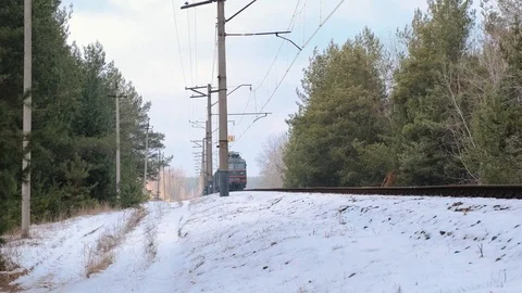 Footage of freight train on rails in winter forest Stock Footage 125478453