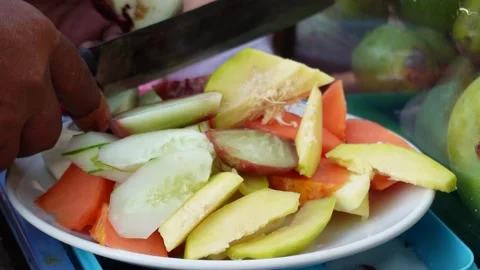 A footage of fruits was being sliced for Indonesian fruit salad with peanut.. Stock Footage 251620249