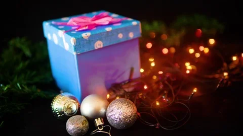 Footage of gift boxes, ball and lamp twinkling for Christmas day Stock Footage 100056321