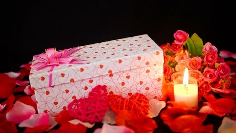 Footage of gift boxes, candle burning and flower for Valentine day Stock Footage 101223146