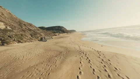 Footage glides along sunlit beach Stock Footage 341827090