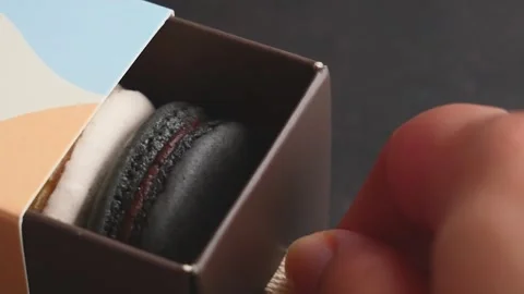Footage, Hand pulling little box showing Fancy color macaroons inside, pack.. Video stock 307403418