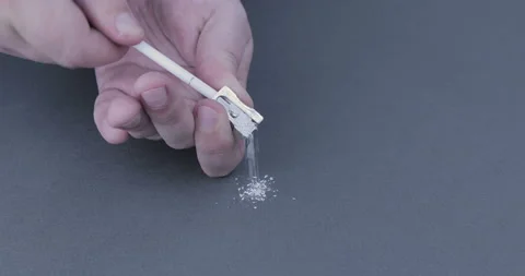 Footage of hands sharpening a pencil with a sharp knife Stock Footage 123019544