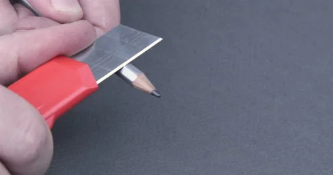 Footage of hands sharpening a pencil with a sharp knife Stock Footage 123023949