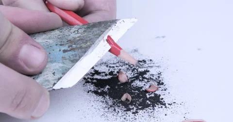Footage of hands sharpening a pencil with a sharp knife Stock Footage 123043427