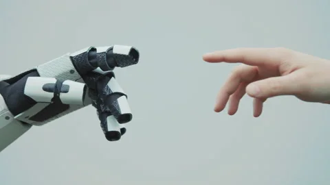 Footage of human-like robot and human touching fingers on white background of Stock Footage 197312841