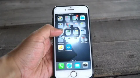 Footage of An Iphone user opening Netflix, scrolling and browsing new movies Stock Footage 88381504