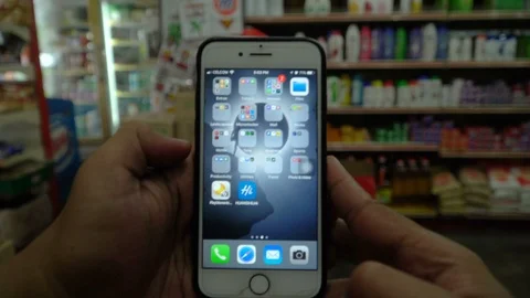 Footage of An Iphone user opening Netflix, scrolling and browsing new movies Video stock 88381600