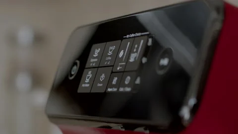 Footage of a making coffee in an automatic red black coffee machine Video stock 198585033