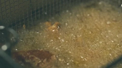 Footage of making fried chicken wings in oil Stock Footage 163337043