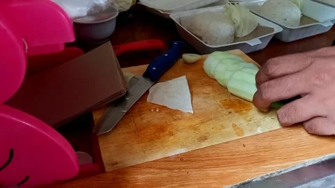 Footage of a man cutting a cucumber Stock Footage