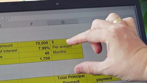 Footage of the man scrolling trough the screen showing excel sheet of the b.. Stock Footage 276535099