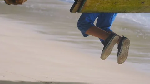 Footage man on a swing by the ocean Stock-Footage 170606090