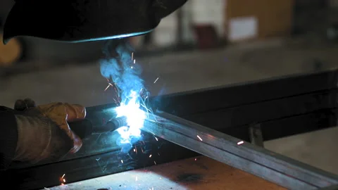 Footage of a man work with grinding a sheet of metal. Close-up. Slow motion Stock Footage