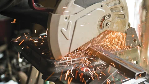 Footage of a man work with grinding a sheet of metal. Close-up Stock Footage 153789371