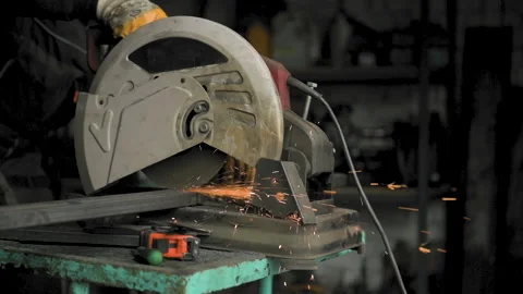 Footage of a man work with grinding a sheet of metal. Close-up. Slow motion Video stock 153789455