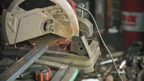 Footage of a man work with grinding a sheet of metal. Close-up Stock Footage 153789764