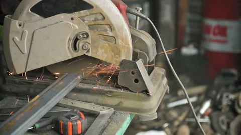 Footage of a man work with grinding a sheet of metal. Close-up Stock Footage 153789907