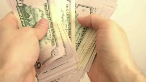 A footage of man's hands counting dollar cash. man counting money for financial Stock-Footage 336262425