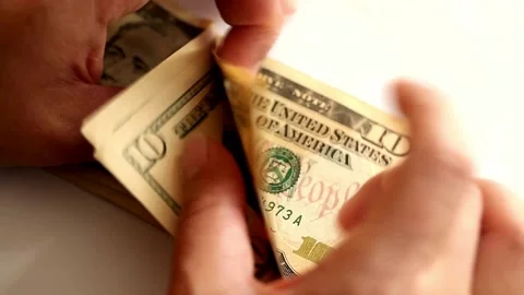 A footage of man's hands counting dollar cash. man counting money for financial Stock-Footage 336262506