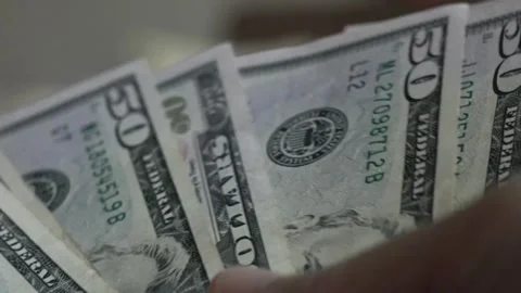 A footage of man's hands counting dollar cash. man counting money for financial Видео 336262520