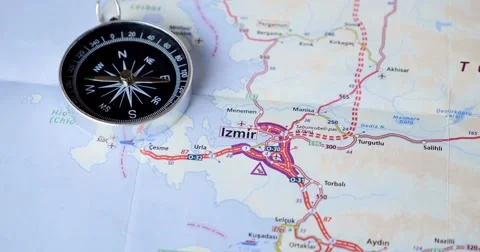 Footage of a map of Turkey and a compass lying on the map which goes crazy Stock Footage 55328342