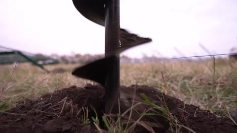 Footage of a massive drill making a hole in the ground, construction site Stock Footage 160112559