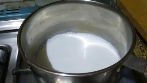 A footage of a milk boiling 動画素材 257036310