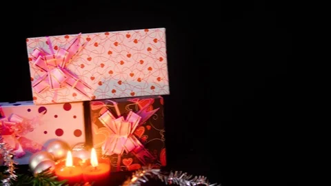 Footage of move gift boxes with candle burning and ornament christmas Stock Footage 100246986