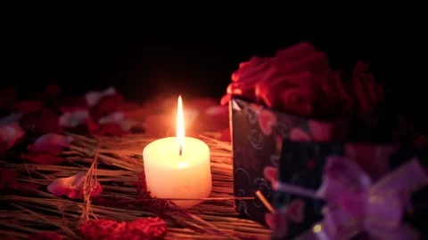 Footage move of gift boxes, petals and candle burning. Valentine day Stock Footage 101564644