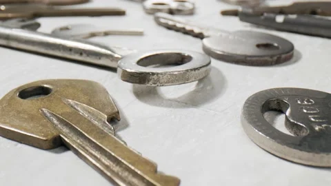 Footage movement over the keys lying on a white background. Stock Footage 211395277