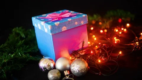 Footage moving of gift boxes, ball and lamp twinkling for Christmas day Stockbeeldmateriaal 100056299