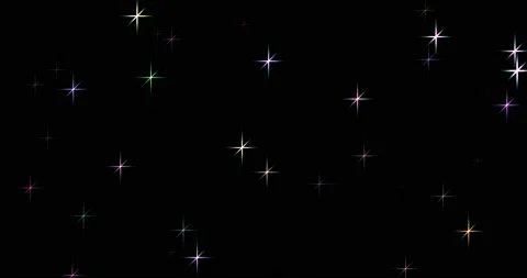 Footage of multi-colored shines asterisks on a black background 4K 3D. New year Stock Footage 199132418
