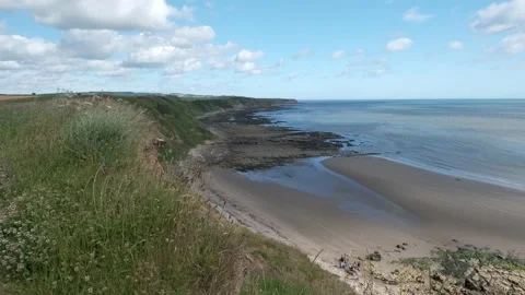 Footage of North Yorkshire coastline with beach and cliffs Stock Footage 201294553