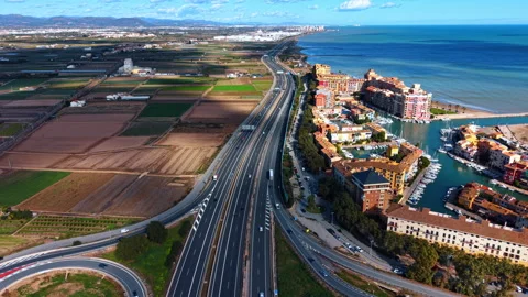 Footage over the lively modern multi-lane highway along the Mediterranean Sea Stock Footage 331571260