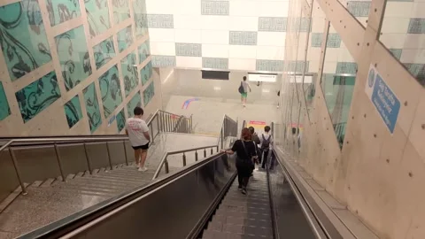 Footage of people using escalators in one of the main stations Stock Footage 241813014