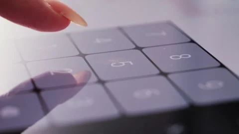 Footage of a person doing basic math on a smartphone calculator. 動画素材 308539083