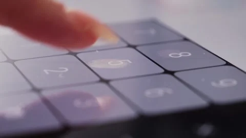 Footage of a person doing basic math on a smartphone calculator. 動画素材 315661828