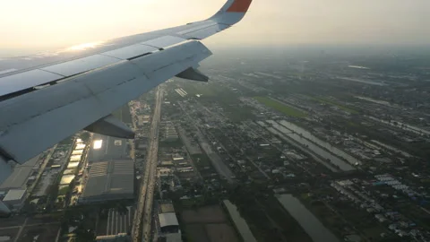 Footage from a plane window low over the city Stock Footage 314645061