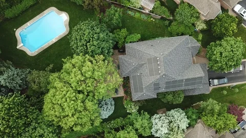Footage of a pristine backyard swimming pool in a luxury suburban home. Stock Footage 90470381